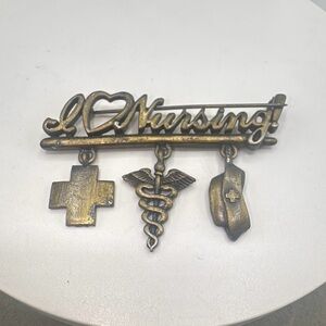Antiqued Gold Tone Nursing Brooch with Charms by JJ